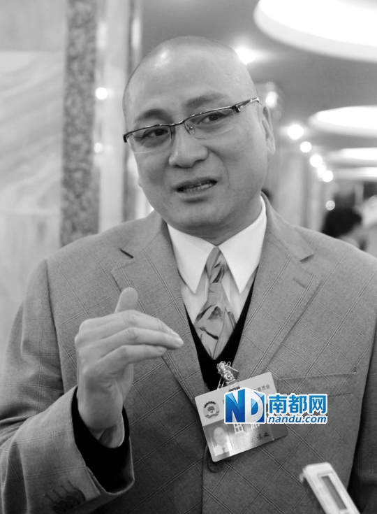    汤镇业.资料图片